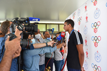 Tunisia's Gold medalist swimmer, Ahmed Hafnaoui speaks to the media upon his arrival at Tunis-Carthage International Airport.Ahmed Ayoub Hafnaoui, 18, joined his illustrious countryman Oussama Mellouli on July 25 in Tunisian sporting history by winning the final of the men's 400m freestyle swimming event during the Tokyo 2020 Olympic Games.