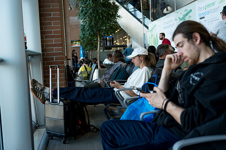 People waiting in the lounge with their luggage are seen at Venice airport. Following the war in Iran and the closure of the Strait of Hormuz, several airports in Italy had to put limitations on jet fuel usage, increasing the uncertainty regarding air travel just as the summer season, when a lot of people travel in Europe, is about to start.