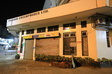 Kenyan homeless sleep outside a cyber café along Monrovia street, during the curfew.
From 10pm – 4am curfew continues in Kenya as part of measures put by the Kenyan government to curb the spread of Covid-19. The government continues to work towards containing the spread of the virus by vaccinating its citizens amid a fourth wave surge of delta variant, with the hope of restoring the country’s economy to normalcy.