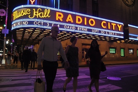 People walk past Radio City Music Hall in Manhattan, New York City.