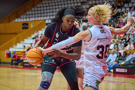 Mariam Coulibaly of Spar Girona and Laura Gil of Hozono Global Jairis in action during match of the Spanish Women's Basketball League, Liga Femenina Endesa, gameday 29 between Spar Girona and Hozono Global Jairis at Fontajau Pavilion