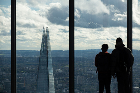 Tourists seen enjoying the view at Horizon 22. Horizon 22 is the highest free observation platform in London, offering a 300-degree view of the city. It's situated on the 58th floor of 22 Bishopsgate and stands at a height of 254 meters above the ground.