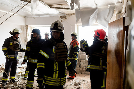 Firefighters check the damage inside the Izium fire station following a Russian shelling attack in Izium. Fire station buildings and multiple vehicles were damaged following a Russian shelling attack in Izium.