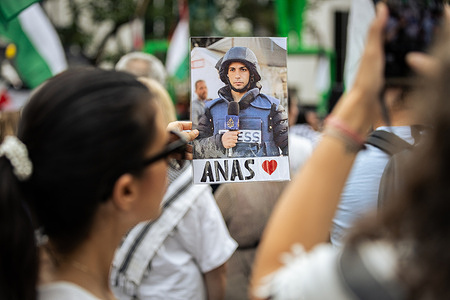 A woman holds a placard with the picture of Anas al-Sharif, Al Jazeera's journalist that was killed by Israeli army at the Gaza Strip during the demonstration. Dozens of people demonstrated to denounce the killing of Al Jazeera's journalists by Israeli army at the Gaza Strip and to call for an end to Israel's genocide of the Palestinian people. There have been repeated demonstrations calling for an end to the Israeli invasion.
