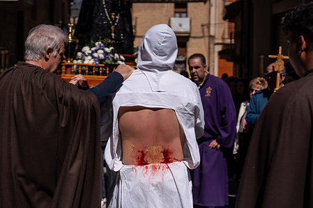 (EDITOR's NOTE: Image contains graphic content)
A masked flagellant bleeds during the procession. In San Vicente de Sonsierra various men called disciplinantes of flagellants, whose identities are kept secret, offer to give penance by walking barefoot sometimes with chains, masked and dressed in white. After walking and praying during the entire procession to the stations of the cross located on the outskirts of the town, the disciplinantes on their return trip to the church, begin the harshest and bloodiest part of the penance, self-flagellation.