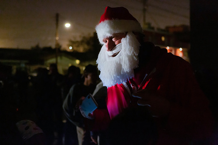 Doug Mclean from Yonkers, New York is an activist, water protector and livestreamer, visited the asylum seeker's camps and delivered basic necessities to the women and candies for the children. Santa made pre-Christmas stops at two of the main asylum-seeker camps, Benito Juarez and el Barretel, an outdoor sports complex now holding approximately 2700 migrants.