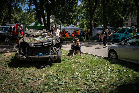 A seated man puts his hands on his head as rescue teams search for dead or survivors after Russia's brutal attack on a residential building in Kyiv. On Monday 23 June, Russia launched a massive drone and missile attack on the Ukrainian capital, leaving nine people dead and 30 injured, including two children and a pregnant woman, according to Svitlana Vodolaha, press officer for the rescue corps that is still working at the spot.