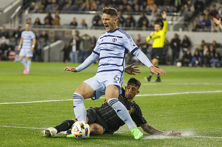 Sporting Kansas City's Nemanja Radoja (L) and Los Angeles FC's Cristian Olivera (R) in action during an MLS soccer match at BMO Stadium.