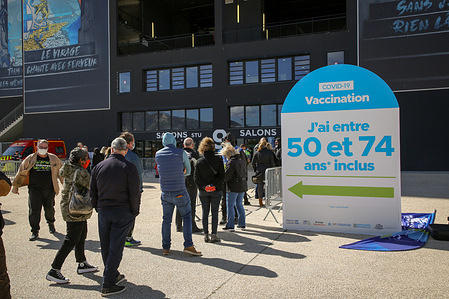 People aged 50 to 74 wait to be vaccinated in the lounges of the football stadium in the city of Marseille.