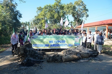 Protesters are seen holding a banner during the protest.
INPT (Indigenous Nationalist Party of Twipra) leaders and supporters protest on the National High way in Khamtingbari, 40 km far from Agartala city to demand for the withdrawal of Citizenship Bill that was Introduced in July 19 in Lok Sabha, the Citizenship Amendment Bill 2016 seeks to allow illegal migrants from certain minority communities in Afghanistan, Bangladesh and Pakistan eligible for Indian citizenship. In other words, it amends the Citizenship Act of 1955.