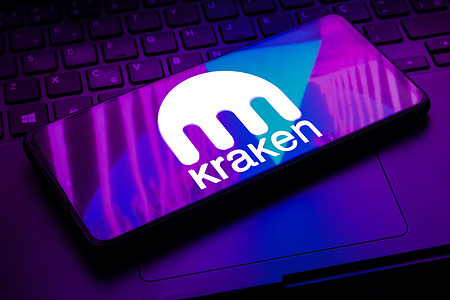 In this photo illustration the Kraken logo seen displayed on a smartphone.