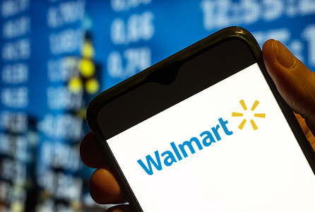 In this photo illustration, the American multinational department stores Walmart logo is displayed on a smartphone screen.