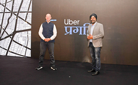 (L-R) Dominic Taylor, Regional General Manager - Rides, Uber APAC and Prabhjeet Singh, President, Uber India and South Asia pose for a photo after unveiling new features which aim to redefine everyday rides making them more affordable, accessible for millions across India at a press conference in Mumbai.