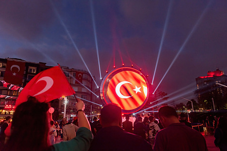 The Turkish flag is projected on the stage in Taksim Square in Istanbul during the celebration of the 100th anniversary of the founding of the Republic of Turkey. Turkish people and tourists celebrated the 100th anniversary of the founding of the Republic of Turkey. Streets in Istanbul are decorated with Turkish flags during the celebration. Modern Turkey's inception traces back to the establishment of the republic on October 29, 1923, with Mustafa Kemal Atatürk assuming the role of its inaugural president. The government was forged from the revolutionary faction headquartered in Ankara under the leadership of Mustafa Kemal Atatürk and his associates.