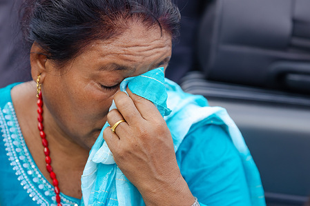 Stranded passenger waits outside Tribhuvan International Airport. Flights were canceled after Iran launched an airstrike on a U.S. military base in Doha, Qatar, prompting Qatar, the United Arab Emirates, and Bahrain to temporarily close their airspace, Around 1000 passengers were affected until the airspace later reopened.