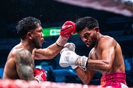 Eumir Felix Marcial (L) and Eddy Colmanares exchange punches during their WBC International middleweight title bout at Araneta Coliseum. Eumir Felix Marcia defeated Eddy Colmanares by unanimous decision to capture the World Boxing Council (WBC) International Middleweight title on the 50th anniversary of the “Thrilla in Manila.” Marcial was knocked down in the 3rd round and again in the 10th round but rallied to outpoint Colmanares after ten hard-fought rounds.