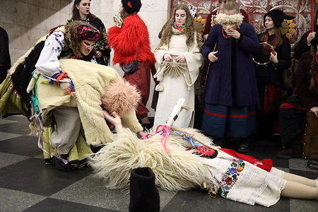 Students of the National University of "Kyiv-Mohyla Academy" seen dressed in festive Christmas costumes during a performance at the Khreshchatyk metro station. A nativity scene with a goat organized by students of the National University of "Kyiv-Mohyla Academy" took place at the Khreshchatyk metro station. The Christmas nativity scene with a goat is an ancient Ukrainian ritual where the Goat (Koza-dereza) symbolizes fertility, prosperity, rebirth and the joy that comes with Christmas and the New Year representing a key figure in carols that "dies" (freezes) and "resurrects" (comes to life) bringing good luck and prosperity to every home which is accompanied by cheerful dancing and generous treats from the hosts.