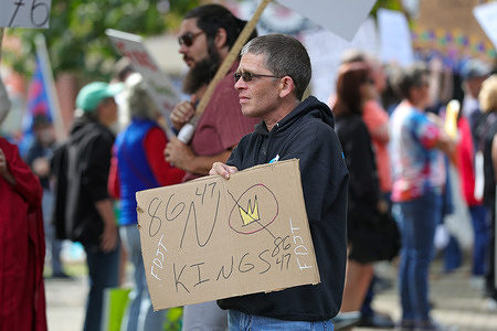 A protester holds a placard expressing his opinion during “No Kings” protest. More than 2,500 No Kings protests against the Trump administration were scheduled across the United States.