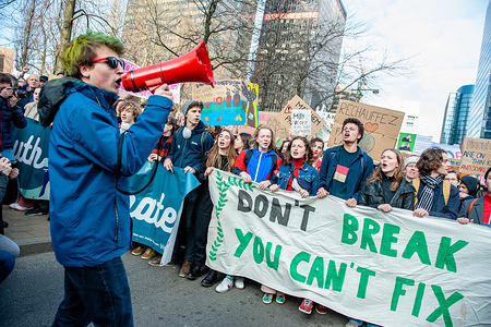 A student is seen shouting slogans in front of the demonstrators during the protest.
For the seventh consecutive time Belgian students skipped school to demonstrate for better climate policy.