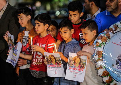 Children take part in a candlelight vigil to condemn the killing of veteran Al-Jazeera journalist Shireen Abu Akleh in Gaza City. Al-Jazeera said Abu Akleh, 51, a prominent figure in the channel's Arabic news service, was shot dead by Israeli troops early on May 11, 2022, as she covered a raid on the Jenin refugee camp on the occupied West Bank.