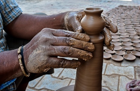 An Indian potter seen making an earthen pot in Patiala district of Punjab, India.