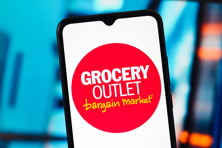 In this photo illustration, the Grocery Outlet logo is seen displayed on a smartphone screen.