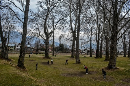 Kashmiri boys play cricket on a cloudy day in Srinagar.
Meteorological department has predicted moderate rain and snow across Kashmir for next three days from Thursday onwards to Sunday forenoon.