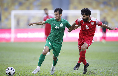 Nurmyradov Selim (L) of Turkmenistan and Jasim Ahmed Alshaikh of Bahrain in action during the AFC Asian Cup 2023 qualifiers match between Bahrain and Turkmenistan at the National Stadium Bukit Jalil. Final score; Bahrain 1:0 Turkmenistan.