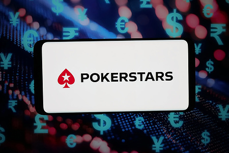 In this photo illustration, the online poker cardroom company PokerStars logo is seen displayed on a smartphone in front of abstract background on computer screen.