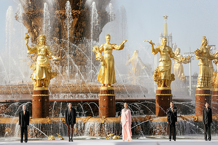 Models walk the outdoor runway during the Moscow Fashion Week at the All-Russian Exhibition Center.