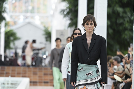 A model parades with Adolfo Domínguez design during the Mercedes Benz Fashion Week Madrid at Cibeles Palace in Madrid.
