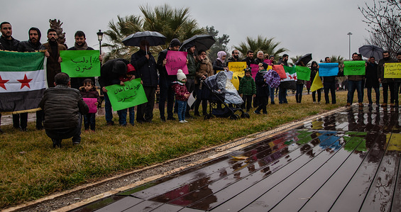 A group of Syrian refugees hold placards during the demonstration.
A group of Syrian refugees in Turkey, the city of Gaziantep protest in solidarity with the people in Syria and also hold signs calling for an end to the bombing of the city of Idlib by Russia and the Assad regime.
