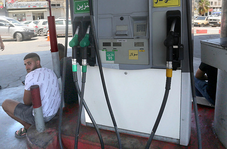 Palestinians wait at a gas station in the West Bank city of Nablus, due to fuel shortages in areas controlled by the Palestinian Authority, headed by President Mahmoud Abbas. The Israeli army closed off Palestinian-controlled areas in the northern West Bank with iron gates and Israeli checkpoints, following the Israeli attack on Iran.