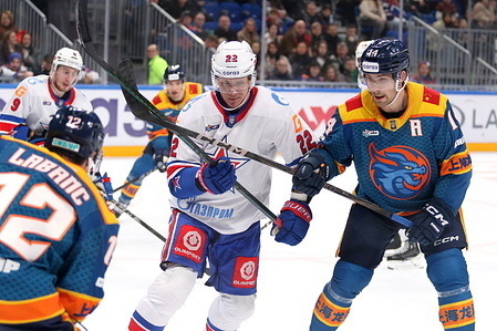 Nikita Zaitsev (22) of SKA, and Riley Sutter (14) of Shanghai Dragons Hockey Club seen in action during the Hockey match, Kontinental Hockey League 2025/2026 between Shanghai Dragons China and SKA Saint Petersburg at the SKA Arena. (Final score; Shanghai Dragons 2:5 SKA Saint Petersburg).