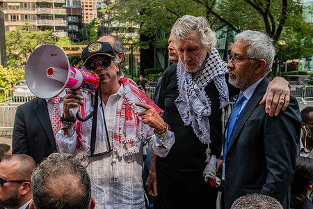 Colombian President Gustavo Petro Urrego with Roger Waters during a speech seen during a pro-Palestinian protest at a plaza near the U.N headquarters. Colombian President Gustavo Petro Urrego, joined by musician and activist Roger Waters, addressed pro-Palestinian demonstrators near the UN headquarters. During the rally, President Petro labeled the Gaza conflict a "genocide" and urged U.S. soldiers to "disobey the orders of Trump," leading the U.S. to revoke his visa.
