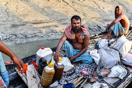 Honey hunters row their boat back home after collecting honey at the Sundarbans in Khulna.