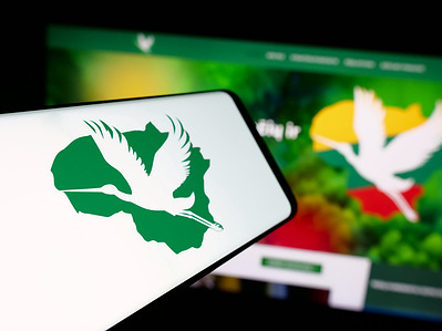 In this photo illustration, a smartphone with the logo of Lietuvos Valstieciu ir Zaliuju Sąjunga (LVZS) is seen on screen in front of website.