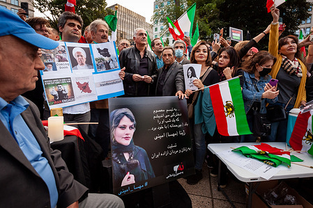 Reza Pahlavi (center), Crown Prince of Iran and son of the Shah deposed in the 1979 revolution, attends a vigil for Mahsa Amini, the young woman who died last week in custody of Iran's morality police. Protests against the 22-year-old's death erupted in Iran and continue daily, accompanied by demonstrations worldwide.