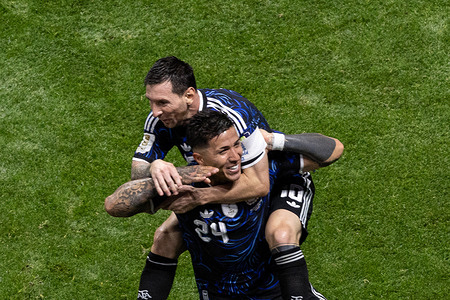 Enzo Fernandez (L) and Lionel Messi of Argentina (R) celebrate after scoring a goal during FIFA World Cup 2026 football match between England and Argentina at Mercedes Benz Stadium. Final score; England 1:2 Argentina.