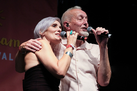 Alison Wheeler, female vocalist former vocalist with The Beautiful South and Gaz Birtles, former saxophone player, performing live on stage with newly formed band The South at Wickham Festival.