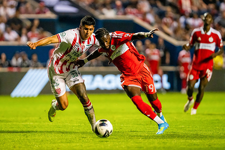 Chicago Fire Forward Jonathan Bamba (19) and Necaxa Defender Raul Martinez (33) in action during the Chicago Fire vs Necaxa match at SeatGeek Stadium. Final Score: Chicago Fire 2: 0 Necaxa