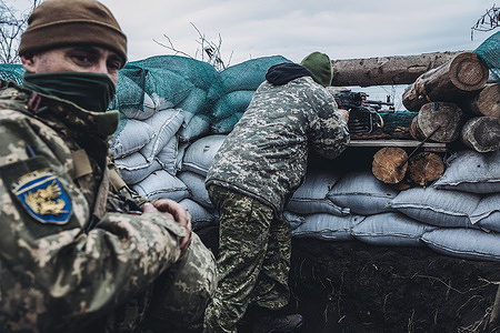 Two soldiers of Ukrainian Army in a position of the contact line in Donetsk.
Since 2014, a war has been going on in Eastern Ukraine in Donetsk and Lugansk oblasts. This territory is in dispute between Ukrainian forces and pro-Russian rebels.