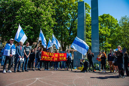 (EDITORS NOTE: Image contains profanity)
A woman is seen reading the charges against Putin to a man dressed as him during the demonstration. On May 8, members of the Russian diaspora in several countries carried out anti-war actions in support of Ukraine. In The Hague, in front of the Russian Embassy, a march took place to the building of The International Court of Justice (ICJ), to hold a symbolic trial against Putin. These event were held just prior to May 9, (known as Victory Day inside Russia) to make a statement against Putin's regime, which has transformed this day into a celebration of militarism, by normalizing the war and using it to serve his own domestic purposes.