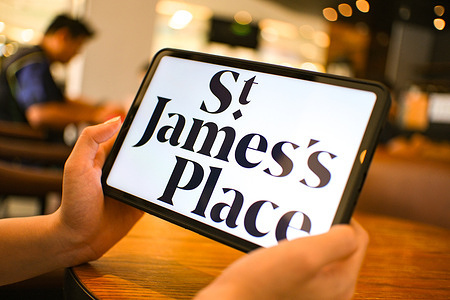 In this photo illustration, the St. James's Place logo is seen displayed on a tablet screen.
