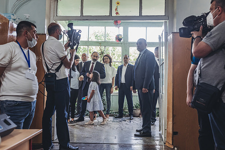 Nikol Pashinyan waits to cast his vote at a polling station in Yerevan during the parliamentary elections.