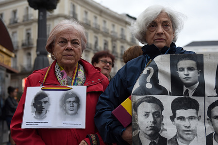 Protesters with pictures of people who went missing during the Spanish dictatorship of Francisco Franco (1936-1975).
Around 50 people gathered in Madrid to protest against immunity for the crimes committed during the Francisco Franco's dictatorship, and to demand justice for victims and relatives. Spanish government has announced that the remains of Franco will be exhumed from Valle de los Caidos mausoleum, where they have lain since his death in 1975, the next week.