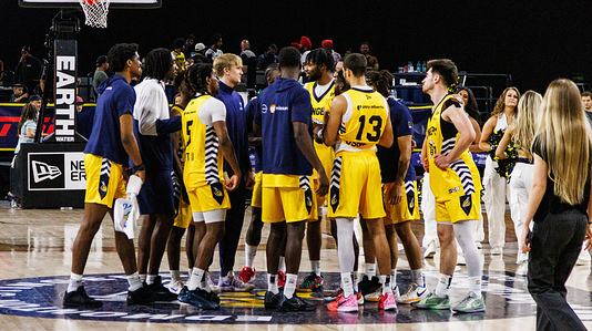 The Edmonton Stingers meet at the center court after the game to cheer for the crowd in attendance. Edmonton Stingers 98 - 81 Scarborough Shooting Stars