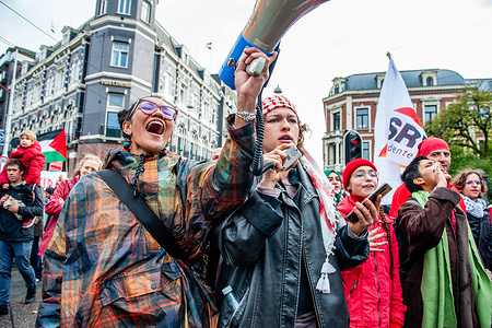 A group of women shouts slogans against Israel's government during the demonstration. Around 250,000 people marched in a massive protest in Amsterdam, calling on the Dutch government to take a firmer stance against Israel and to help end the genocidal violence in Gaza. Demonstrators, many wearing something red to symbolize the “red line” said that the Dutch government has crossed by its inaction.