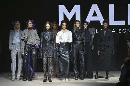 A model walks the runway wearing a design by Malne during the Mercedes-Benz Fashion Week de Madrid in IFEMA.