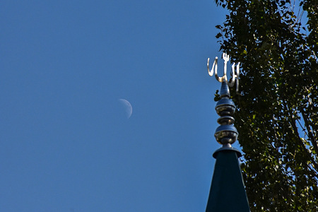 The waxing crescent moon rises on the outskirts of Srinagar, the summer capital of Jammu and Kashmir.
